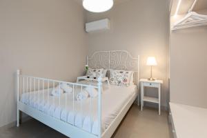 Postel nebo postele na pokoji v ubytování Villa Basilio