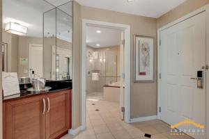 a bathroom with a walk in shower and a sink at MGM Signature-03-703 Strip View Jacuzzi Studio in Las Vegas