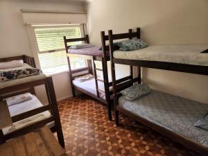 Postel nebo postele na pokoji v ubytování Hostel Capivara's Curitiba