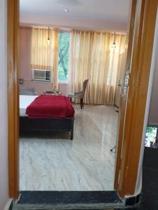 Postel nebo postele na pokoji v ubytování Bharat Vandana Stay