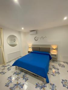 Ένα ή περισσότερα κρεβάτια σε δωμάτιο στο Casa Vacanze dell'Arco - civico 17