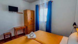 Postel nebo postele na pokoji v ubytování La Tortuga Lodging Rooms