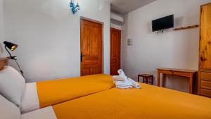 Postel nebo postele na pokoji v ubytování La Tortuga Lodging Rooms