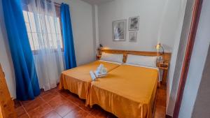 Postel nebo postele na pokoji v ubytování La Tortuga Lodging Rooms