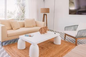 a living room with a white coffee table and a couch at Sierra del Mar in Playa del Ingles