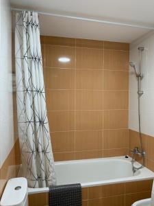 a bathroom with a bath tub and a toilet at Casa Chocolate in San Miguel del Pino