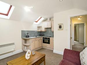 A kitchen or kitchenette at Suite 2 