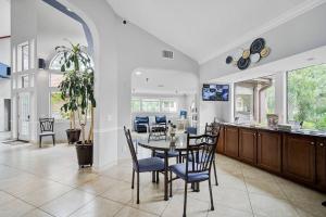 a dining room and kitchen with a table and chairs at Shore Serenity in Bradenton