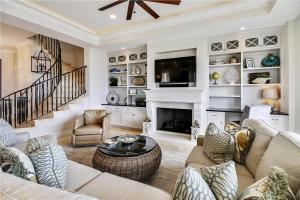 a living room with a couch and a fireplace at 31 Singleton Beach- Oceanfront luxury home, spectacular views & private pool, FREE Activities Included in Hilton Head Island