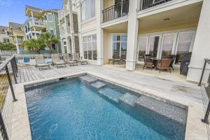 a swimming pool in the backyard of a house at 4 Collier Beach Rd- Oceanfront, Private Pool, Elevator, FREE Activities Included in Hilton Head Island