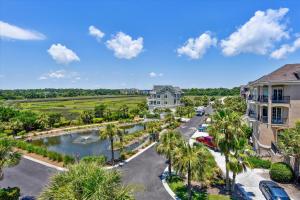 an aerial view of a resort with a river and palm trees at 4 Collier Beach Rd- Oceanfront, Private Pool, Elevator, FREE Activities Included in Hilton Head Island