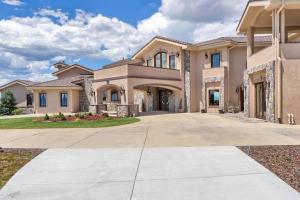 a large house with a driveway at Luxury Mansion Retreat Sleeps 20 Panoramic VIEWS in Castle Rock
