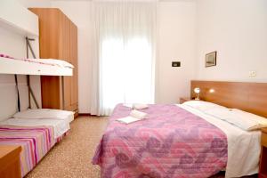 Cama o camas de una habitación en Hotel Edera