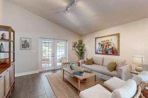 a living room with a couch and a table at Bayside Bungalow in Tampa