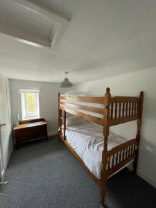 a bedroom with a bunk bed in a room at FREE HOT TUB use, Exclusive Idyllic Large Themed Cumbrian Mill Countryside 100s 5star most loved in Carlisle