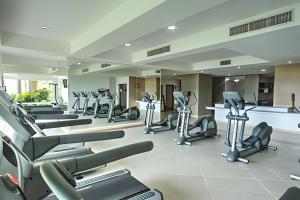 a gym with a row of treadmills and ellipticals at Exquisite Oceanfront Condo outstanding experience! in Puerto Vallarta