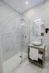 a bathroom with a shower and a sink at Napoli Class in Naples +53 photos