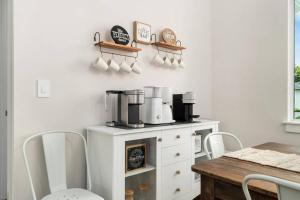 a kitchen with a counter with a coffee maker on it at Deja Blu in Marco Island +39 photos