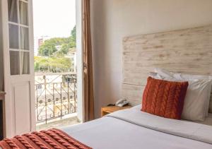 Cama ou camas em um quarto em Kastel Grão Pará