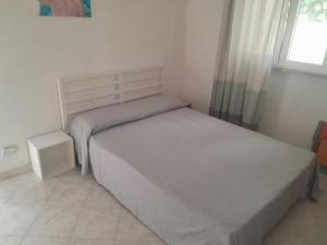 Ένα ή περισσότερα κρεβάτια σε δωμάτιο στο Casa del 'Sole'