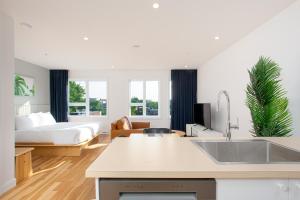 a kitchen and living room with a bed at Les Lofts de Vitré - Par Les Lofts Vieux-Québec in Quebec City +97 photos