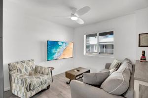 a living room with a couch and a chair at Ocean Breeze Gated Community in Marathon