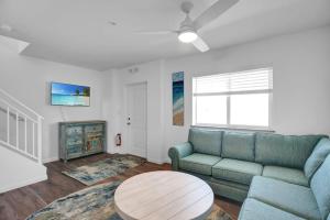 a living room with a couch and a table at Green Turtle Retreat at Ocean Isles in Marathon