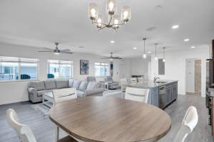 a kitchen and living room with a table and a couch at Blue Octopus Hideaway at OI in Marathon