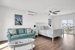 a living room with a couch and a table at Blue Octopus Hideaway at OI in Marathon +42 photos