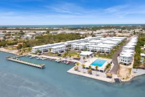 an aerial view of a resort with a marina at Ocean Isles Rustic Inn in Marathon