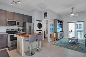 a kitchen with stainless steel appliances and a counter at Oceanside Spacious Studio Escape in Marathon