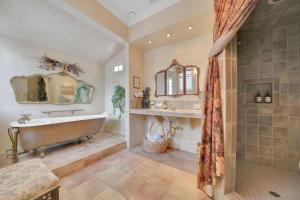 a large bathroom with a tub and a sink at Timeless Victorian Gem w Breathtaking Mountains in Sutter Creek +21 photos