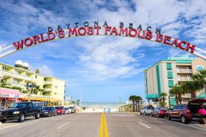 a sign that readsdream a beach worlds most famous beach at Relaxing 3 bed 2 bath home by the intracoastal in Daytona Beach