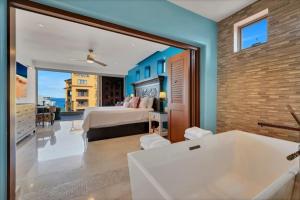 Postel nebo postele na pokoji v ubytování New PH style 3BD on Medano Beach + 51 fotografií