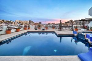 a swimming pool on the roof of a building at Completely Remodeled 2BD-2BA Plaza Bonita in Cabo San Lucas