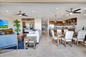 a living room and dining room with a table and chairs at 2BD-2BA Condo at Ventanas 3B in Cabo San Lucas