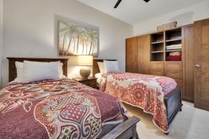 a bedroom with two beds and a dresser at 2BD-2BA Condo at Ventanas 3B in Cabo San Lucas +30 photos