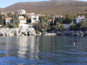a view of a body of water with a city at Apartments Rudi - Superior One bedroom Apartment with Terrace and Sea View in Klenovica