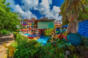 a painting of a pool at a water park at Pousada das Galinhas in Porto De Galinhas