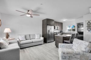 a living room with a couch and a kitchen at Ocean Side Paradise Awaits in Marathon