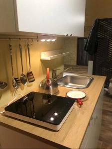 a kitchen counter top with a sink and a sink at al VECCHIO ARCO Borgo Antico in Bari