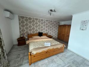 a bedroom with a wooden bed in a room at Camere individuale cu baie proprie in Timisoara in Timişoara +7 photos