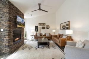 a living room with a couch and a fireplace at Evergreen On Main in Blowing Rock +17 photos