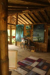 a large room with a large painting on the wall at Maskani Wasi in Lago Agrio
