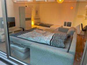 a room with two beds and a glass window at Appartement Kirschblüte in Seehof