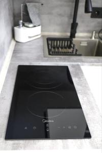a tablet sitting on a counter in a kitchen at Бизнес-класса in Kostanay