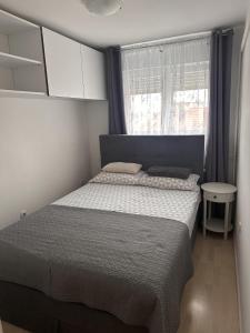 Posteľ alebo postele v izbe v ubytovaní Prekrasan mali stan Matilda u Zagrebu