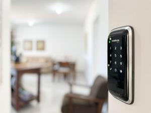 a remote control attached to a wall at Resid. Clube Mar Grosso - Laguna - LAG801 in Laguna