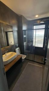 a bathroom with a sink and a glass shower at Villa RADA in Bogazici