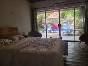 Postel nebo postele na pokoji v ubytování Hostal Hilltop Palomino